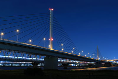 Low angle view of bridge against sky at night