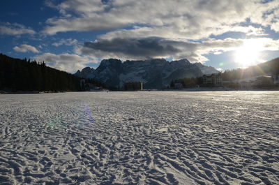 Scenic view of snow covered landscape against sky