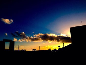 Silhouette of built structure at sunset