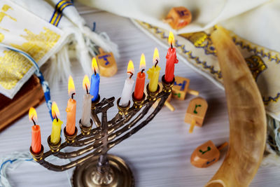 Close-up of colorful candles on table during hanukkah