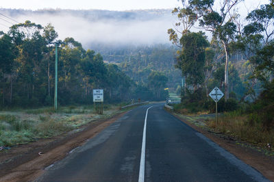 Road with no overtaking on bridge road sign. rural infrastructure landscape