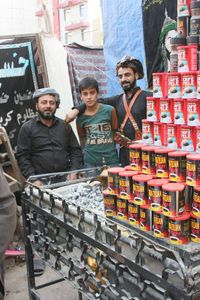 Portrait of happy young couple standing in market