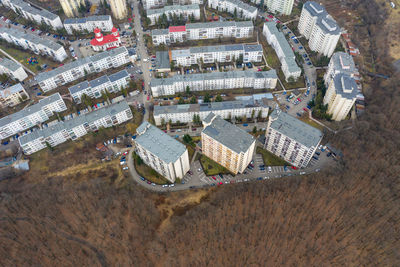 Aerial view of urban environment taking place of nature. expanding flat of blocks occupy forest