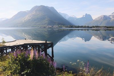 Scenic view of lake and mountains against sky