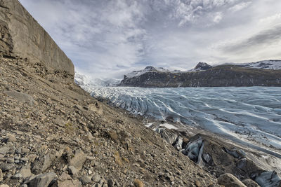 Scenic view of mountains and glacier against sky