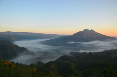 Scenic view of mountains against sky during sunset