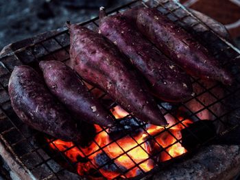 High angle view of meat on barbecue grill