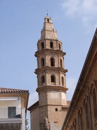 Low angle view of bell tower against sky