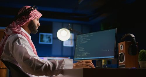 Midsection of woman using digital tablet in office