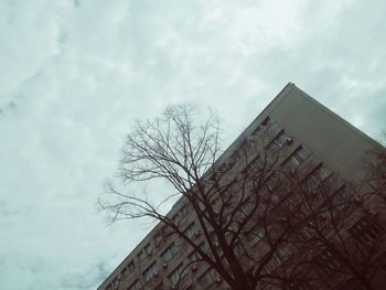 Low angle view of built structure against cloudy sky