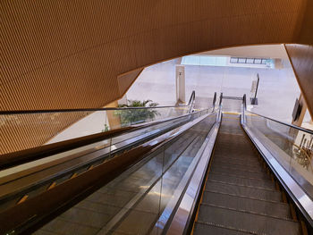 High angle view of escalator miving up and down with no passenger 