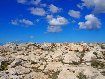 Scenic view of mountain against blue sky