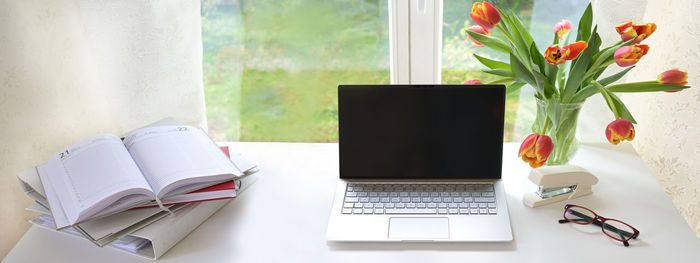 Close-up of laptop on table