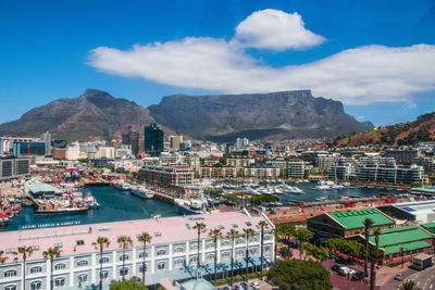 High angle view of town against cloudy sky