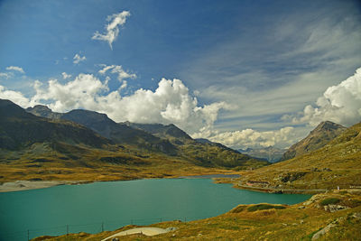 Scenic view of lake and mountains against sky