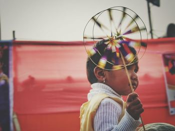 Close-up of girl holding pinwheel