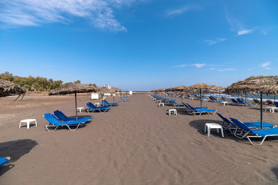 Scenic view of beach against blue sky