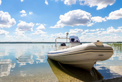 Nautical vessel moored on sea against sky