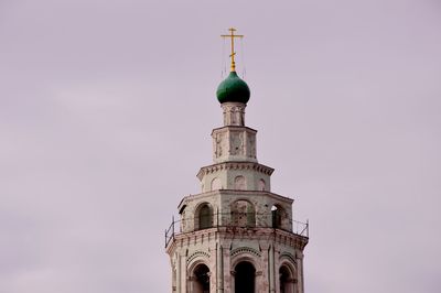 Low angle view of bell tower against sky