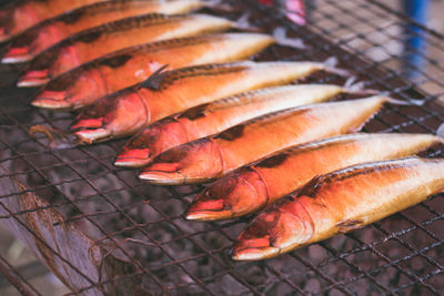 High angle view of fish on barbecue grill