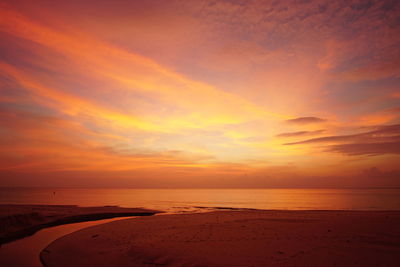 Scenic view of sea against orange sky