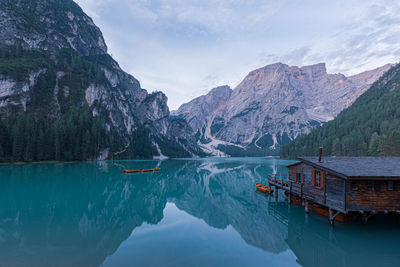 Scenic view of lake and mountains against sky