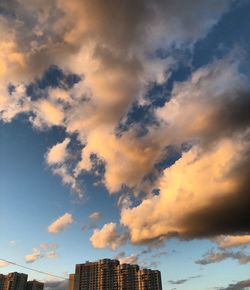 Low angle view of buildings against sky during sunset