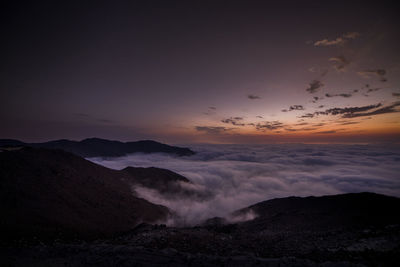 Scenic view of mountains against sky during sunset