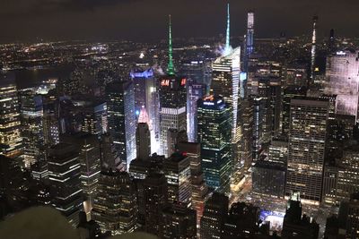 Aerial view of city lit up at night