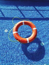 High angle view of life belt in swimming pool