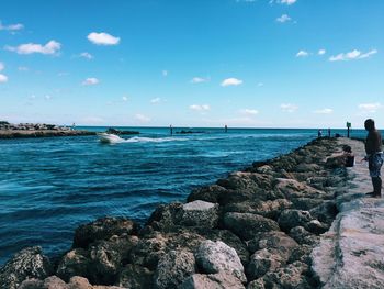 Scenic view of sea against blue sky