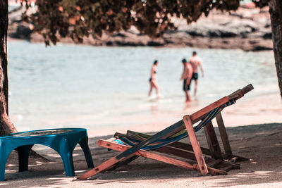 Deck chairs and table at beach