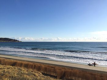 Scenic view of beach against clear sky