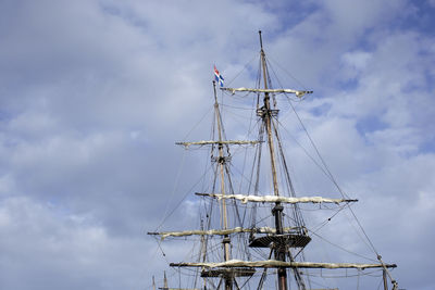 Low angle view of sailboat in sea against sky