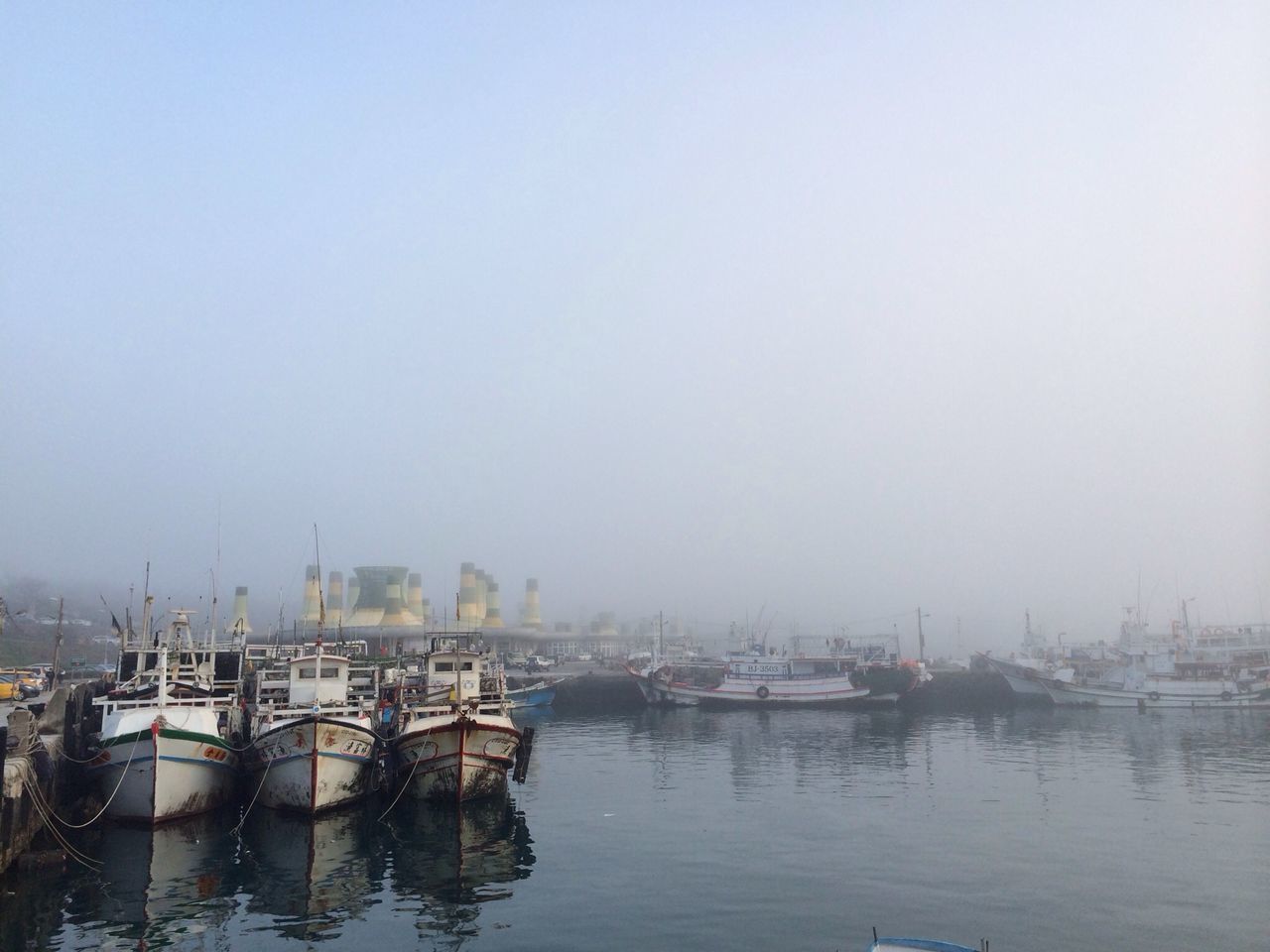 water, nautical vessel, boat, moored, transportation, mode of transport, clear sky, waterfront, copy space, sea, reflection, lake, nature, harbor, tranquility, tranquil scene, sailboat, day, sky, outdoors