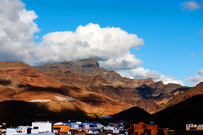 Houses with mountain range in background