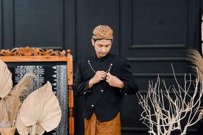 Men wearing traditional javanese clothes