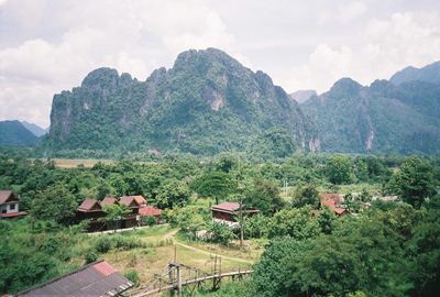 Scenic view of mountains against cloudy sky