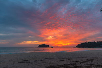 Scenic view of sea against romantic sky at sunset