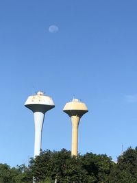 Low angle view of tower against clear blue sky