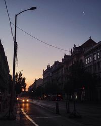 View of city street at dusk