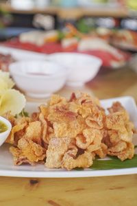 Close-up of food served on table