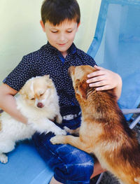 Full length of a boy with cat