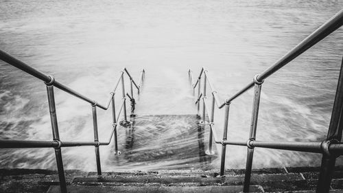 High angle view of ladder by sea