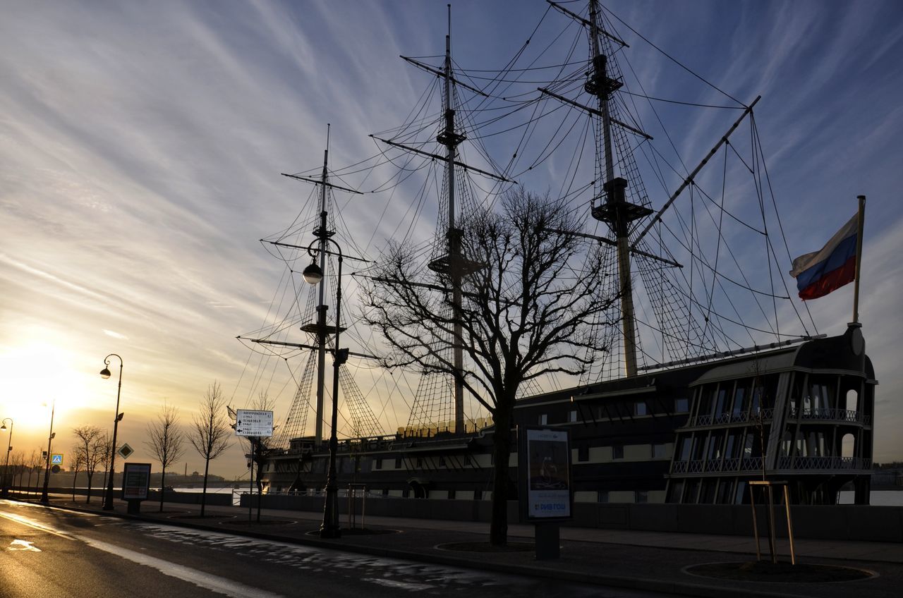 transportation, sky, architecture, mode of transportation, evening, ship, vehicle, nature, cloud, sunset, city, built structure, road, street, nautical vessel, no people, building exterior, sailboat, dusk, outdoors, travel, urban area, travel destinations, pole, cityscape, sailing ship
