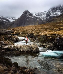 Full length of person on snowcapped mountains during winter