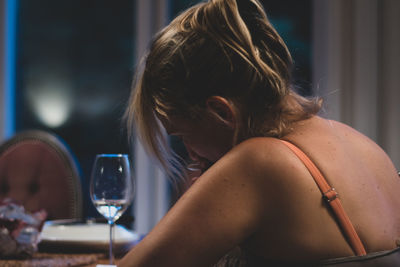 Rear view of woman using mobile phone