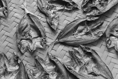 High angle view of dried fish on wicker plate