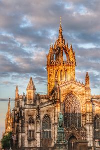 Low angle view of cathedral against cloudy sky