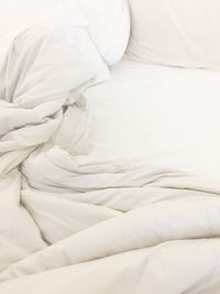 High angle view of messy bed